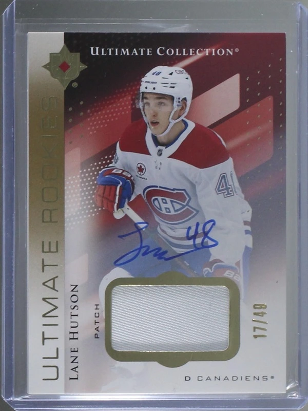 Lane Hutson Ultimate Rookies patch autograph, with red diagonal panels, a white patch window and visible 17/49 numbering.