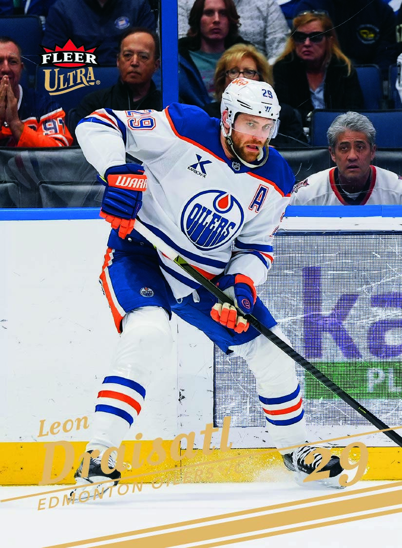 Leon Draisaitl Gold Spectrum preview with white Edmonton uniform, gold logo and gold lettering over a full rink photograph.