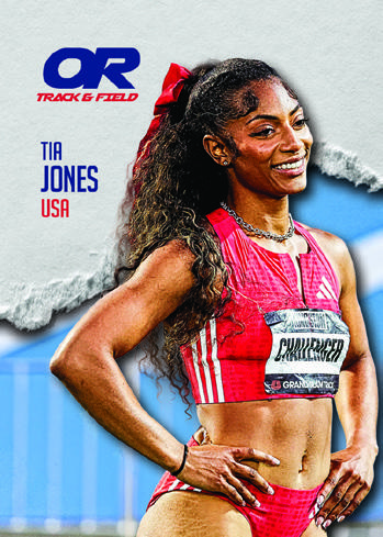 Tia Jones smiling in a red racing kit against blue trackside scenery.
