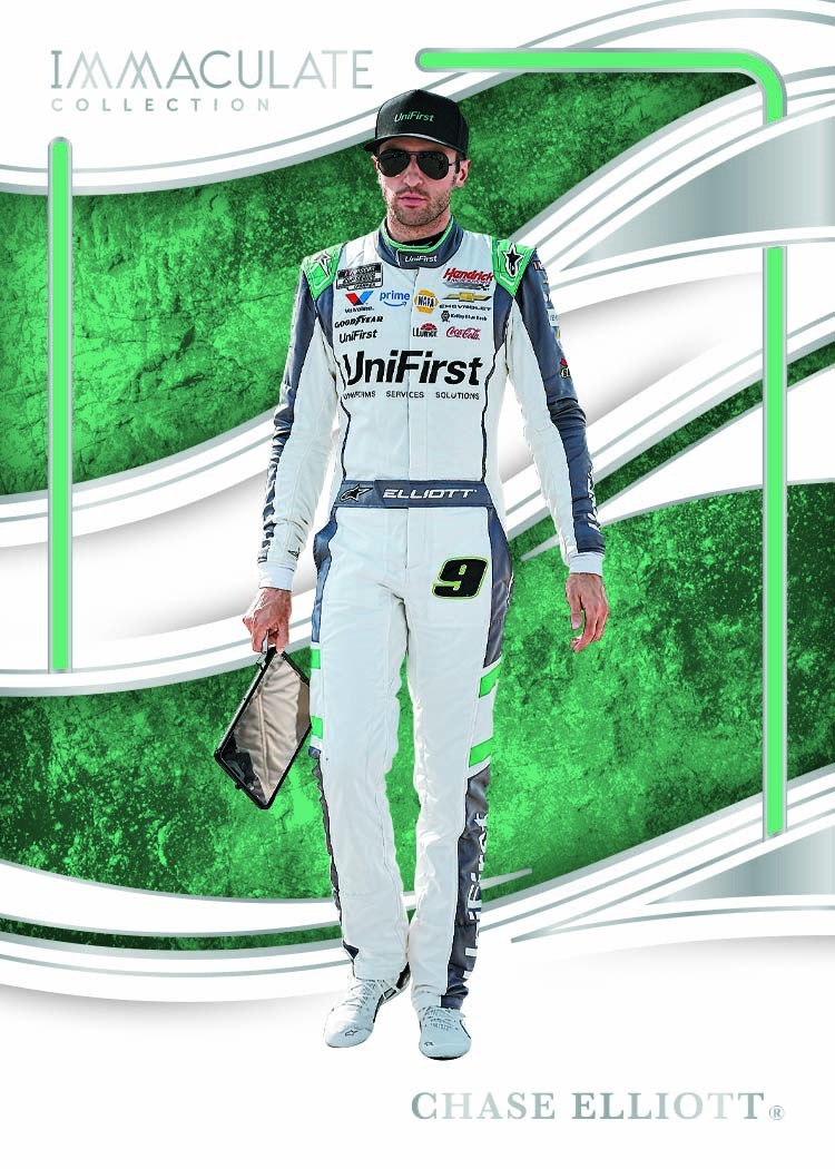 Chase Elliott in a white-and-green firesuit against green fields and sweeping white borders.