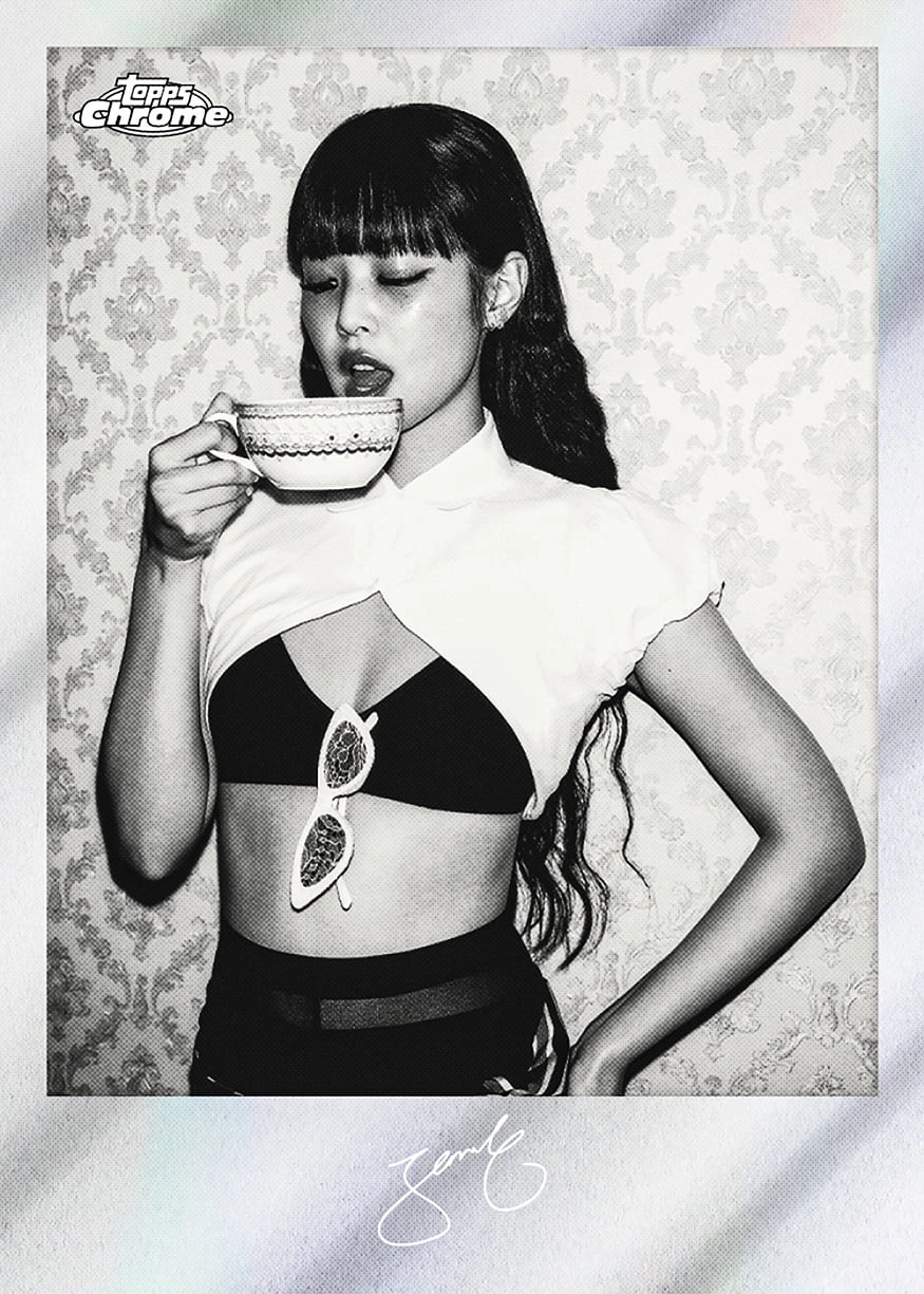 Jennie holds a teacup in a black-and-white Monochrome Mementos preview with a broad pale lower border.