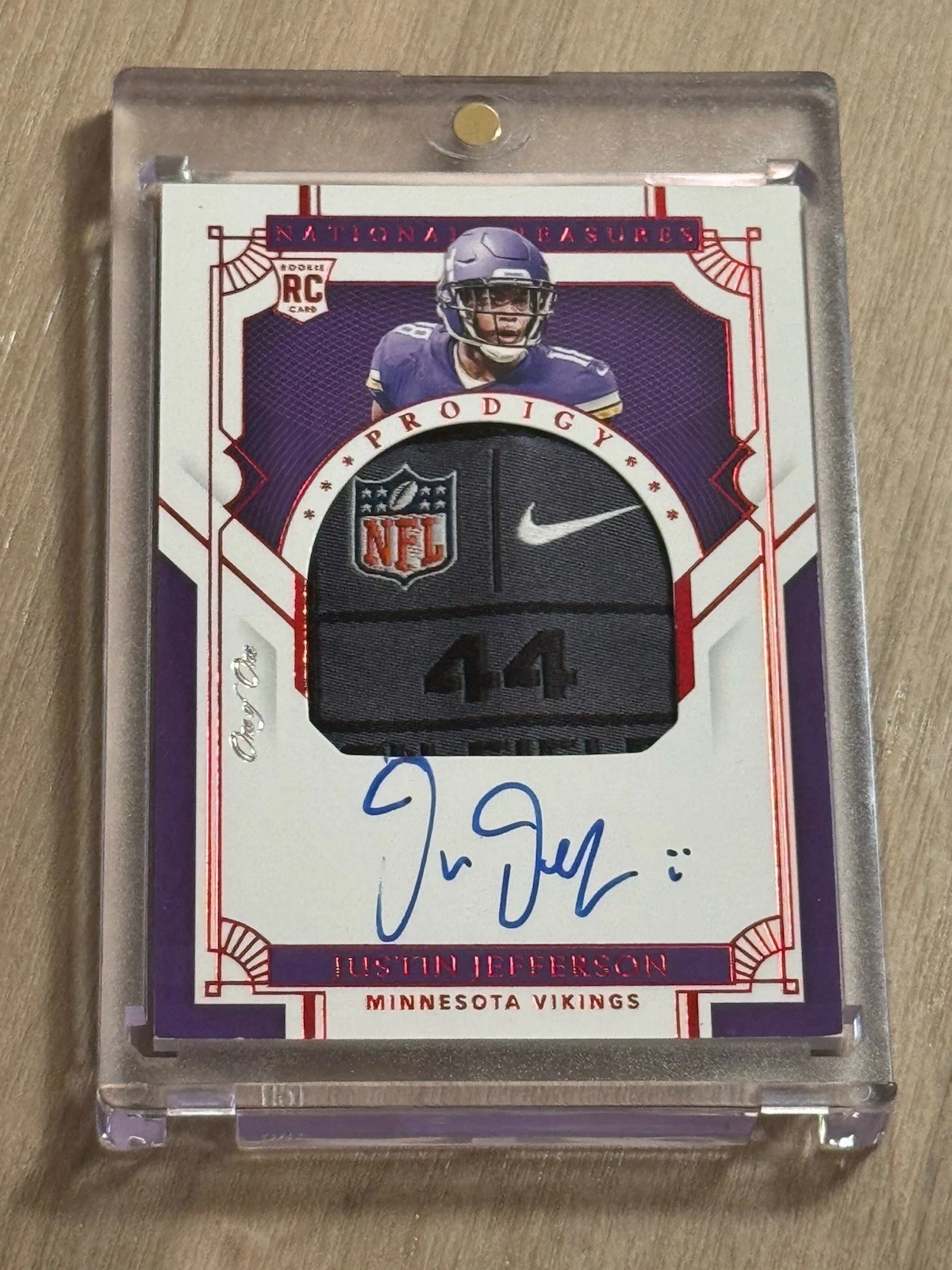 Justin Jefferson’s National Treasures Prodigy autograph with an oversized NFL/Nike size-44 tag and One of One stamp.